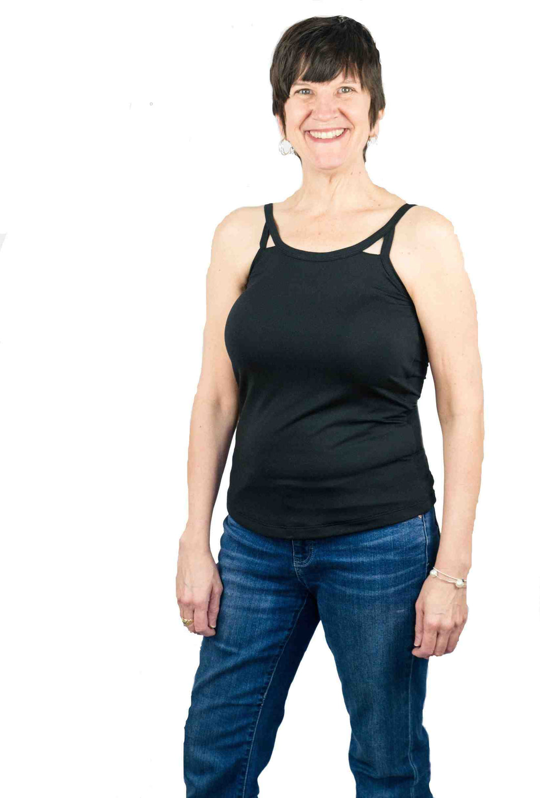 Mastectomy bra camisole with integrated breast forms in cut out tank top and no bra band on sensitive skin or mastectomy scars